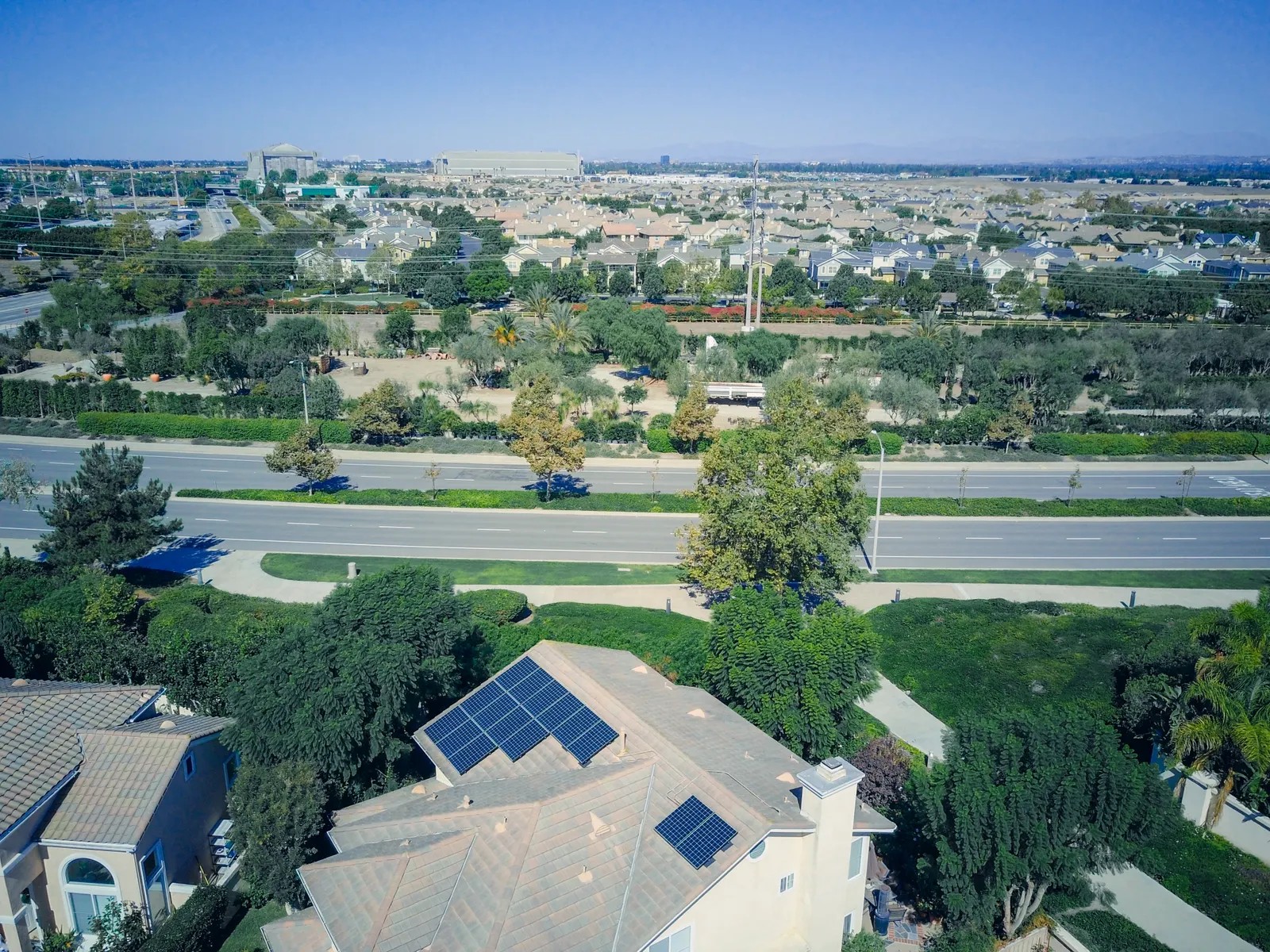 Aerial view of a suburban home with rooftop solar panels